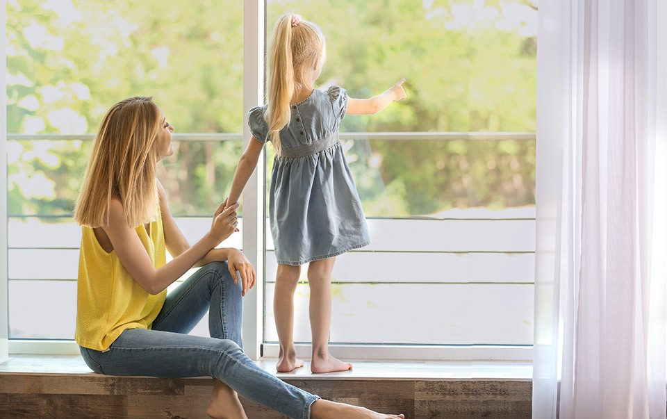 Family enjoying the natural light from their windows